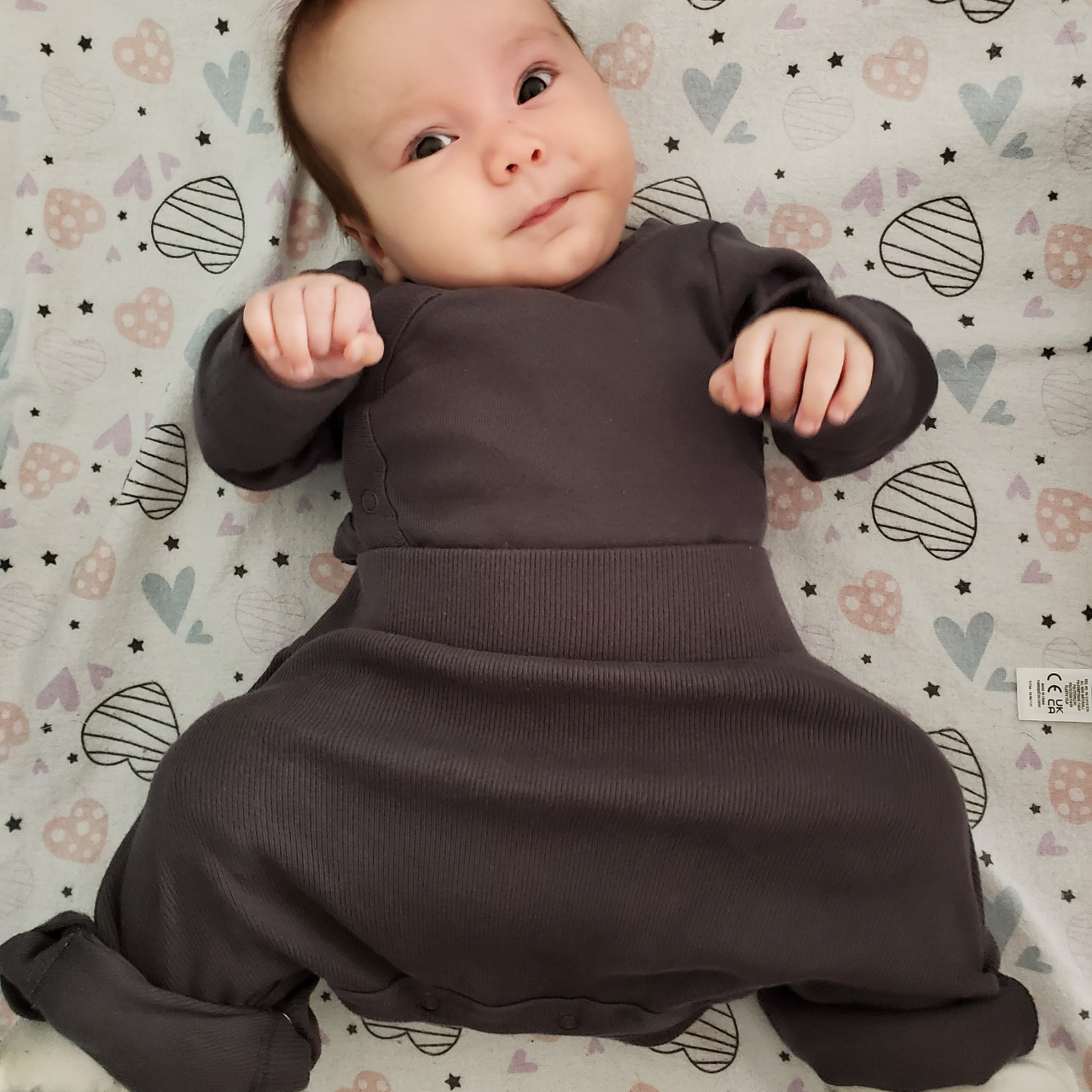 Author Laura's daughter in the pavlik harness under a special onesie made specifically for babies with hip dysplasia 